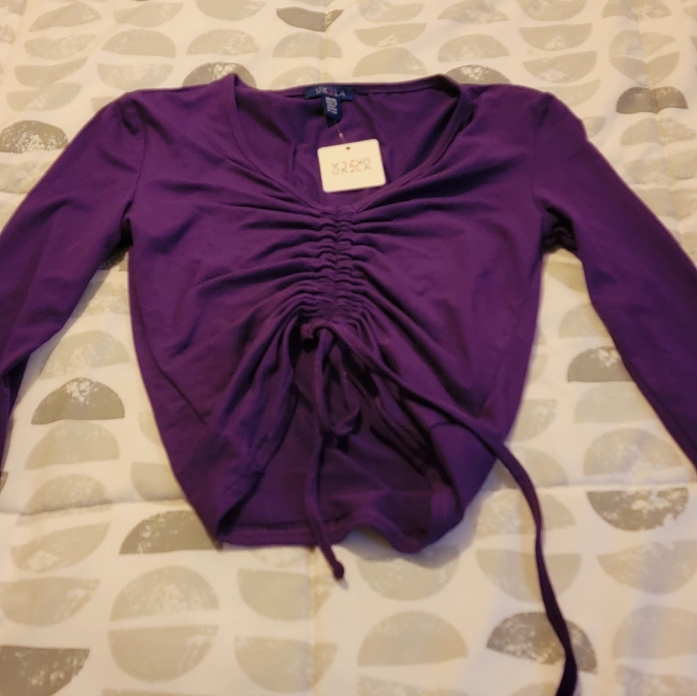 Brand new with tags beautiful deep purple top.